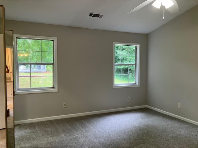 spare room featuring carpet floors and ceiling fan