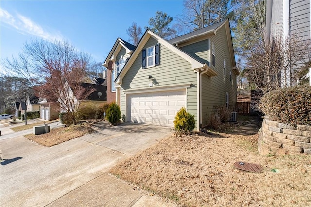 view of property exterior with a garage