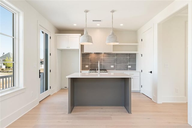 260 Guild Ln, Fayetteville, GA 30214 - kitchen with hanging light fixtures, open shelves, backsplash, and light wood finished floors
