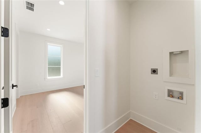 260 Guild Ln, Fayetteville, GA 30214 - washroom with laundry area, washer hookup, light wood-style flooring, electric dryer hookup, and visible vents
