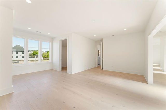 260 Guild Ln, Fayetteville, GA 30214 - unfurnished living room featuring recessed lighting, baseboards, and light wood-style flooring