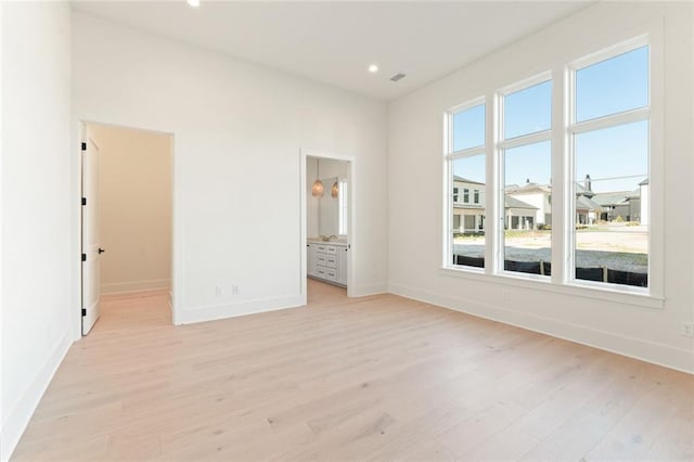 260 Guild Ln, Fayetteville, GA 30214 - unfurnished bedroom with visible vents, baseboards, a walk in closet, light wood-type flooring, and recessed lighting