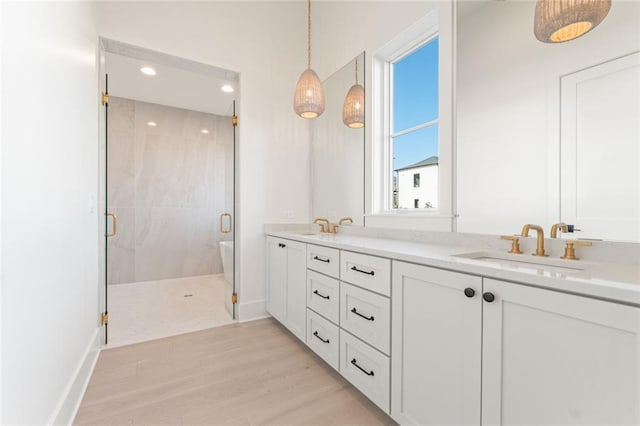 260 Guild Ln, Fayetteville, GA 30214 - full bathroom with double vanity, a sink, a stall shower, and a wealth of natural light