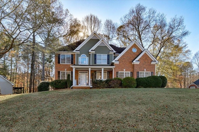 view of front of property featuring a porch and a front yard