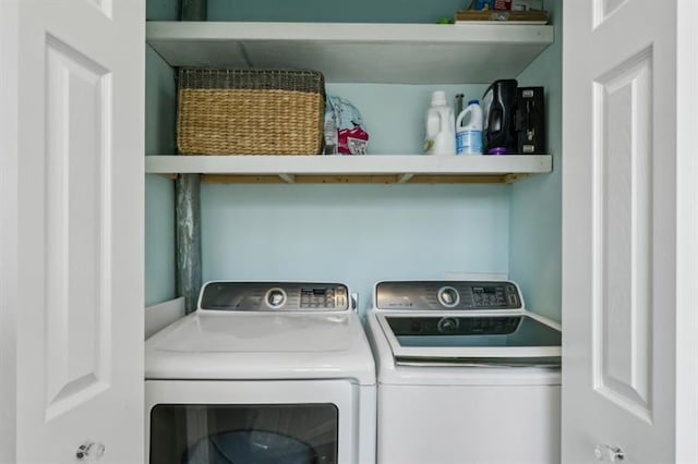 clothes washing area with washer and dryer and laundry area