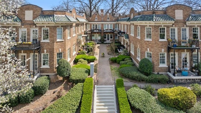 view of property's community featuring stairway