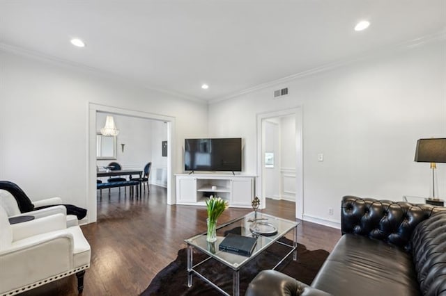 living room with dark wood-style flooring, visible vents, and recessed lighting