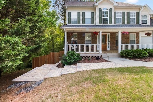 view of front of house with a front lawn and a porch