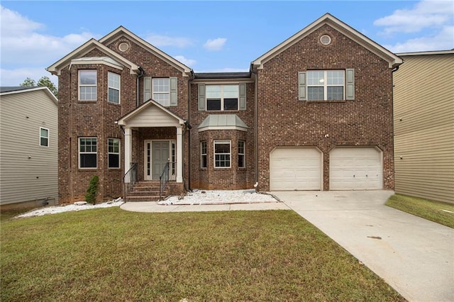 view of front of house with a front yard and a garage