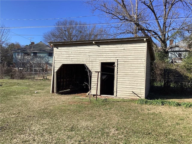 view of outbuilding with a lawn