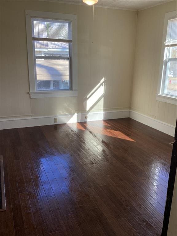 unfurnished room featuring dark wood-type flooring