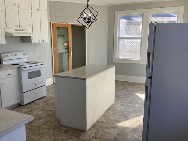 kitchen with electric stove, decorative light fixtures, black fridge with ice dispenser, and white cabinets