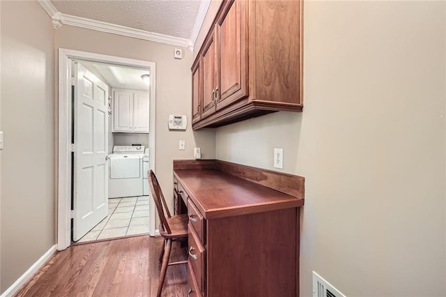 3592 Midvale Cv, Tucker, GA 30084 - unfurnished office with separate washer and dryer, light wood finished floors, crown molding, baseboards, and a textured ceiling