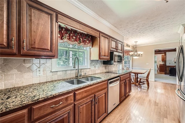 3592 Midvale Cv, Tucker, GA 30084 - kitchen featuring dishwashing machine, a sink, stainless steel microwave, light stone countertops, and light wood-style floors