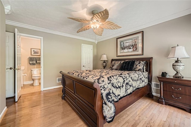 3592 Midvale Cv, Tucker, GA 30084 - bedroom featuring light wood-type flooring, baseboards, ornamental molding, ensuite bath, and a ceiling fan