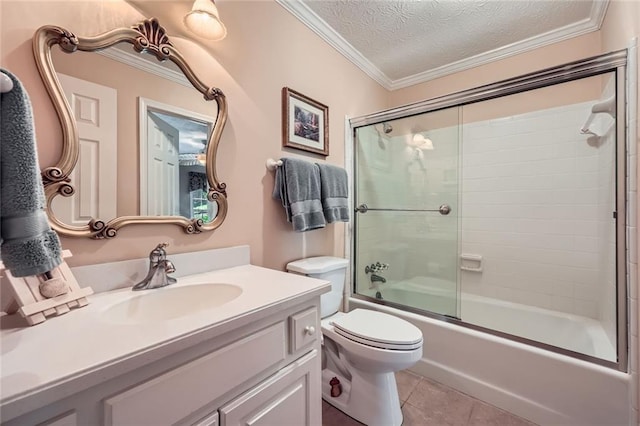 3592 Midvale Cv, Tucker, GA 30084 - bathroom featuring vanity, tile patterned floors, toilet, enclosed tub / shower combo, and crown molding