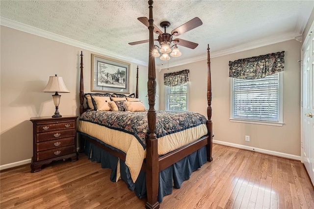 3592 Midvale Cv, Tucker, GA 30084 - bedroom with light wood-style floors, baseboards, crown molding, a textured ceiling, and ceiling fan
