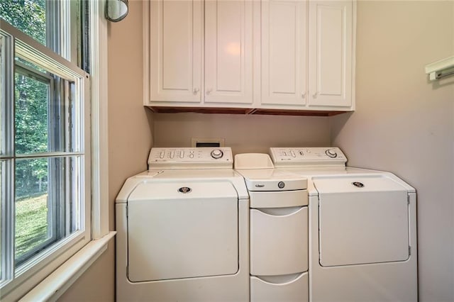 3592 Midvale Cv, Tucker, GA 30084 - laundry area with washing machine and dryer, healthy amount of natural light, and cabinet space