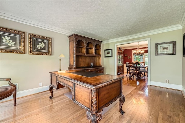 3592 Midvale Cv, Tucker, GA 30084 - office space featuring a chandelier, light wood-style flooring, baseboards, a textured ceiling, and crown molding