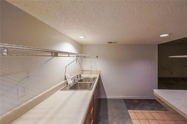 3601 Club Dr NW, Kennesaw, GA 30144 - laundry room featuring a sink, recessed lighting, a textured ceiling, and tile patterned floors