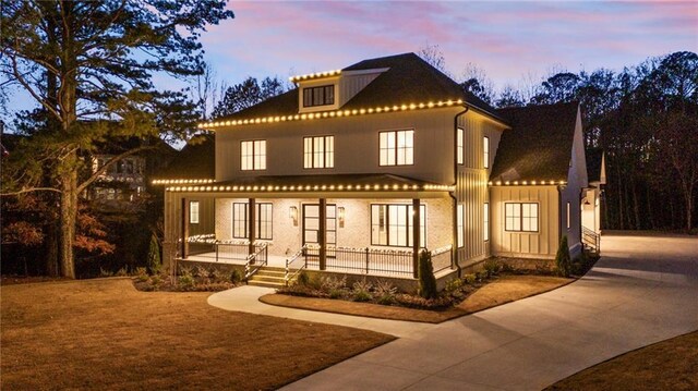 mediterranean / spanish-style house with covered porch