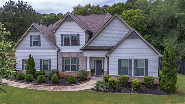 2103 Sourwood Ct, Monroe, GA 30656 - craftsman-style house with brick siding and a front lawn