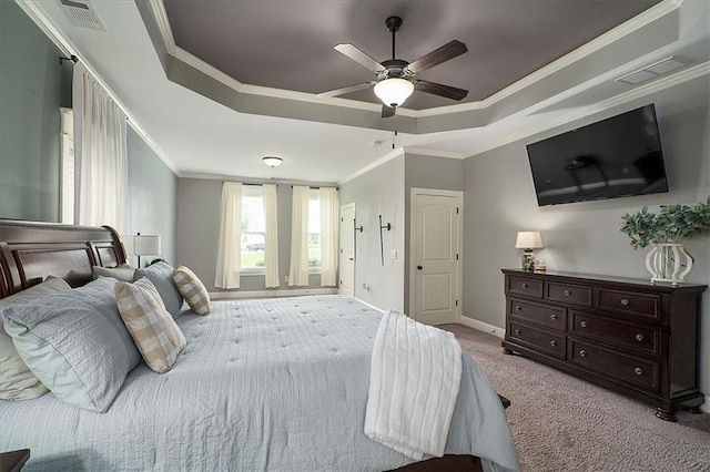 2103 Sourwood Ct, Monroe, GA 30656 - bedroom featuring a tray ceiling, carpet floors, ornamental molding, and a ceiling fan