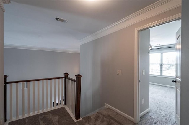 2103 Sourwood Ct, Monroe, GA 30656 - hall featuring carpet flooring, crown molding, and an upstairs landing