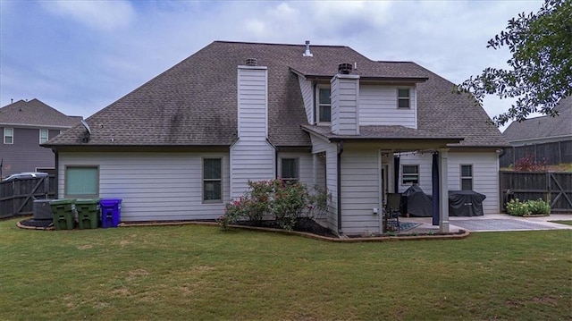 2103 Sourwood Ct, Monroe, GA 30656 - rear view of house featuring a patio area and roof with shingles