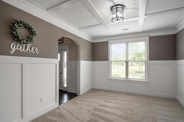 2103 Sourwood Ct, Monroe, GA 30656 - empty room with arched walkways, coffered ceiling, carpet floors, wainscoting, and beam ceiling