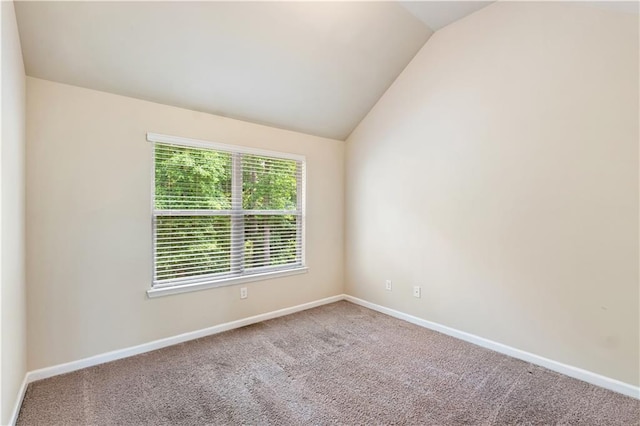 7946 White Oak Loop, Stonecrest, GA 30038 - carpeted empty room featuring lofted ceiling and baseboards