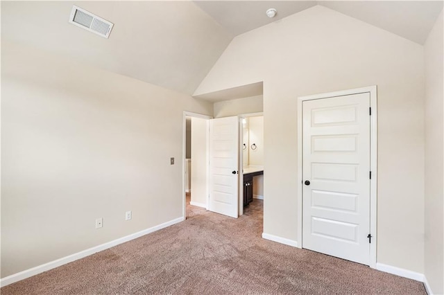 7946 White Oak Loop, Stonecrest, GA 30038 - unfurnished bedroom featuring vaulted ceiling, carpet flooring, and baseboards