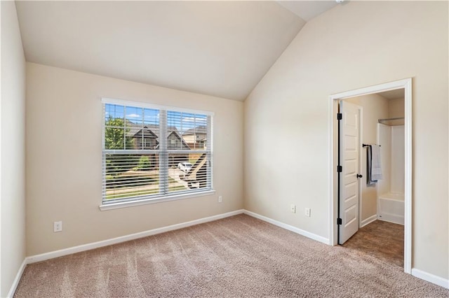 7946 White Oak Loop, Stonecrest, GA 30038 - empty room featuring carpet floors, lofted ceiling, and baseboards