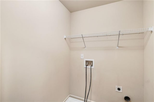 7946 White Oak Loop, Stonecrest, GA 30038 - laundry room with hookup for an electric dryer, hookup for a washing machine, and baseboards