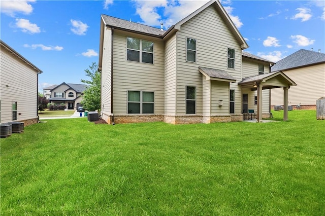 7946 White Oak Loop, Stonecrest, GA 30038 - rear view of house with a lawn, central AC unit, and roof with shingles