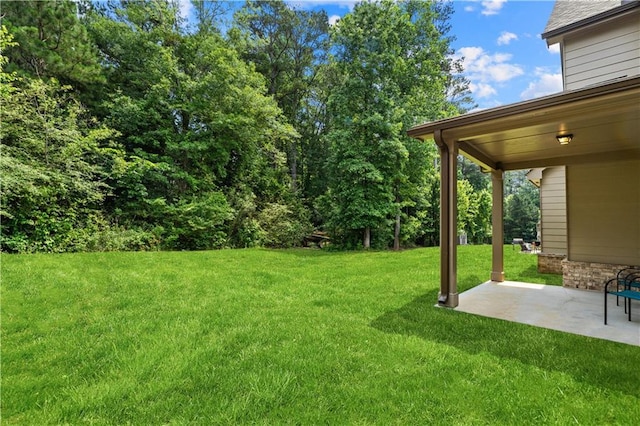 7946 White Oak Loop, Stonecrest, GA 30038 - view of green lawn featuring a patio