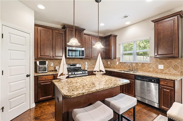 7946 White Oak Loop, Stonecrest, GA 30038 - kitchen with appliances with stainless steel finishes, a sink, dark wood-type flooring, light stone countertops, and recessed lighting