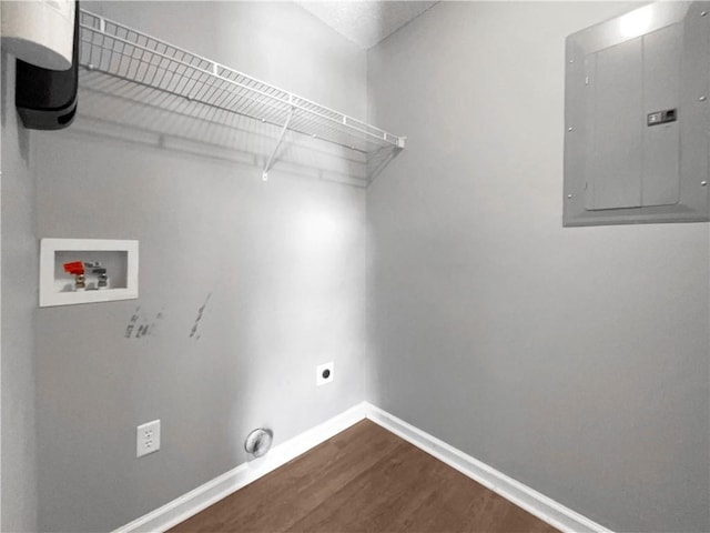 laundry room with hookup for a washing machine, dark wood-style floors, baseboards, laundry area, and electric panel