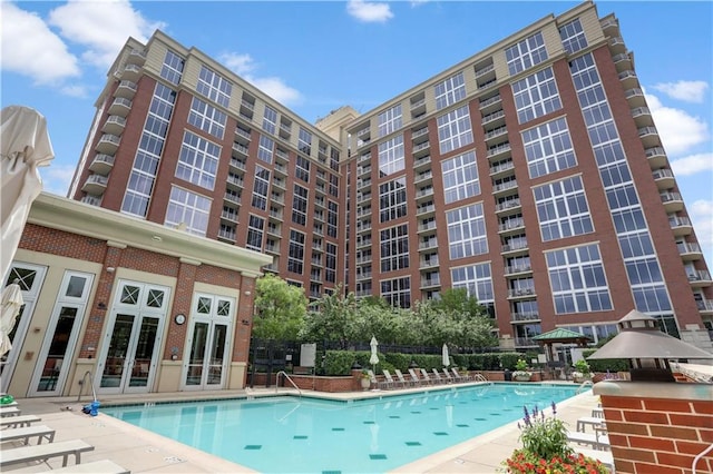 community pool featuring french doors