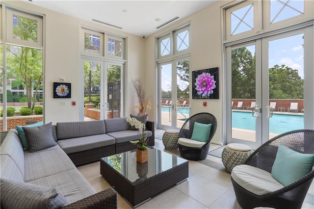 sunroom with visible vents and french doors