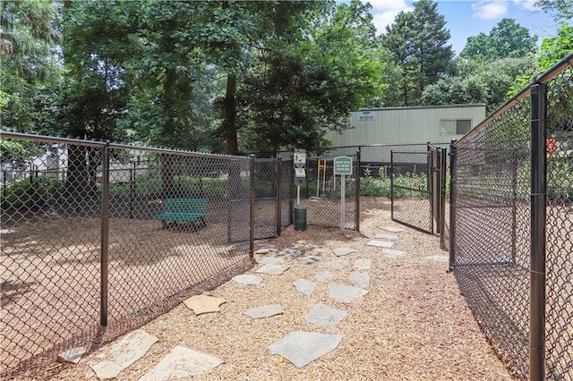 view of gate featuring fence
