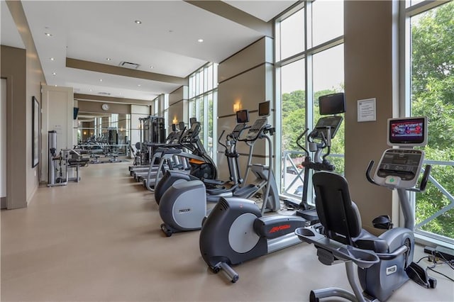 workout area with floor to ceiling windows and visible vents