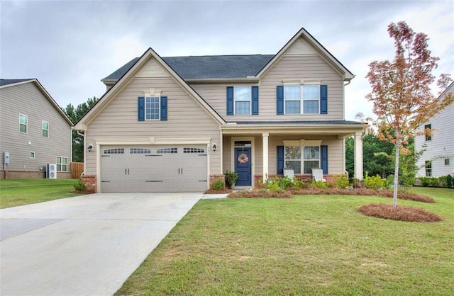 craftsman inspired home with a garage, a front yard, and covered porch