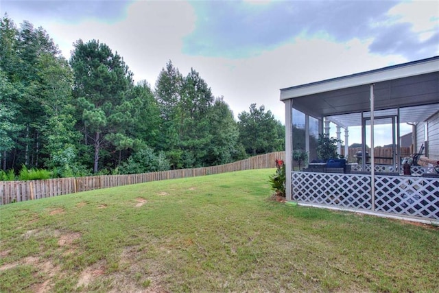 view of yard with a sunroom