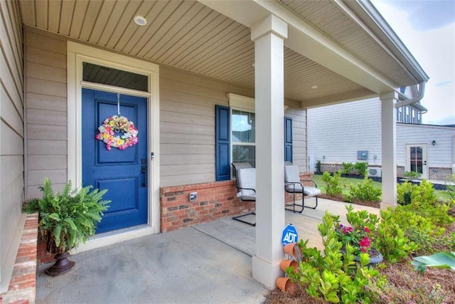 doorway to property featuring a porch