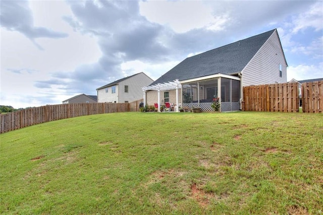 view of yard with a pergola and a sunroom