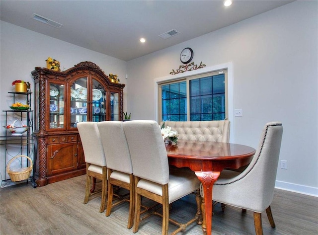 dining room with wood-type flooring