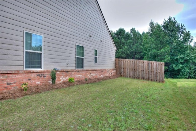 view of property exterior with a yard