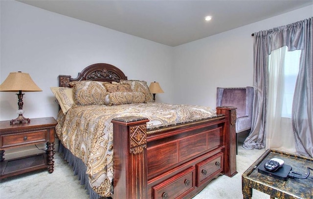 bedroom featuring light colored carpet