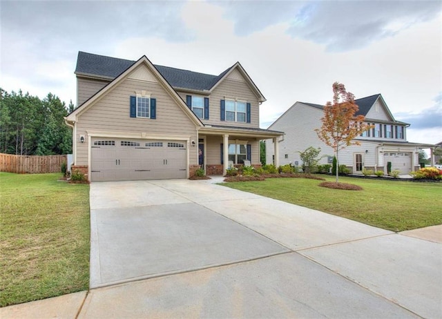 craftsman-style home with a garage, a front yard, and a porch